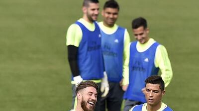 Sergio Ramos and Cristiano Ronaldo run during a training session. Gerard Julien / AFP