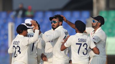 India's Axar Patel, centre, celebrates the wicket of Bangladesh's Mushfiqur Rahim in the first Test. AP