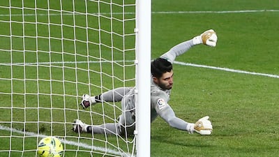 Granada's Rui Silva is beaten by Lionel Messi for Barca's third. Reuters