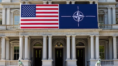The US flag alongside the Nato flag outside the Eisenhower Executive Office Building in Washington. Reuters