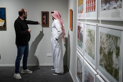 George Al Ama, left, co-owner of Gallery One in Ramallah, is exhibiting Palestinian work at Art Dubai 2025. Antonie Robertson / The National