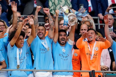 Manchester City captain Ilkay Gundogan lifts the FA Cup after their victory against Manchester United at Wembley Stadium. AP