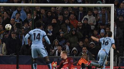 Manchester City's Sergio Aguero scores his team's lone goal in their 2-1 loss to Barcelona on Tuesday night in the Champions League last 16 first leg match. Lluis Gene / AFP