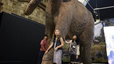 Children look at a Columbian Mammoth during a press preview at the Natural History Museum’s Mammoths, Ice Age Giants exhibition in London, Britain, on May 21, 2014. The exhibition will open from the May 23 until September 7. Facundo Arrizabalaga / EPA