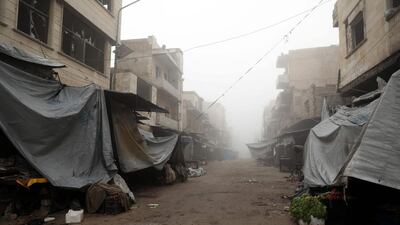 An empty market street in Maaret Al Numan. AFP