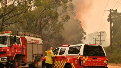 Firefighters conduct back-burning measures to secure residential areas from encroaching bushfires in the Central Coast, some 90-110 kilometres north of Sydney. AFP