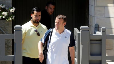 President Macron flanked by former bodyguard Alexandre Banalla, who was filmed assaulting protesters (Reuters)