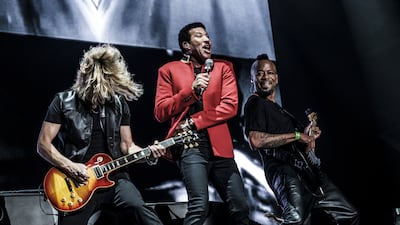 Lionel Richie performs at the du Arena on Yas Island in Abu Dhabi. Below, the crowd waits in anticipation of their favorite artists at Beats on the Beach. Waleed Shah for The National