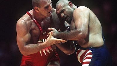 Alexander Karelin, the Siberian wrestler, right, claimed he could see fear in his opponents’ eyes when they came face to face.