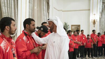 Sheikh Mohammed bin Zayed, Crown Prince of Abu Dhabi and Deputy Supreme Commander of the UAE Armed Forces (R), speaks with a member of the UAE Special Olympics team, during a Sea Palace barza. Mohamed Al Hammadi / Crown Prince Court - Abu Dhabi