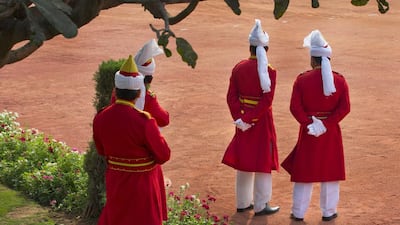 Indian presidential staff watch as Sheikh Mohammed bin Zayed, Abu Dhabi Crown Prince and Deputy Supreme Commander of the Armed Forces arrives at the Indian presidential palace. Manish Swarup / AP Photo