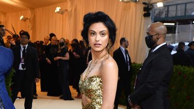 American actress and singer, Camila Mendes, wearing a gold Ami gown. AFP