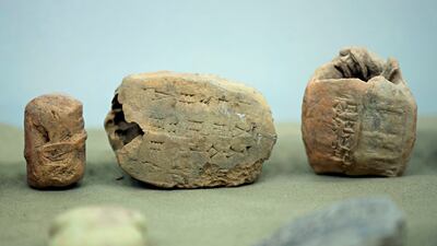 Iraq's Ministry of Antiquities displays some of the 337 artifacts that were stolen in the weeks after the fall of Saddam Hussein's regime in 2003. AP