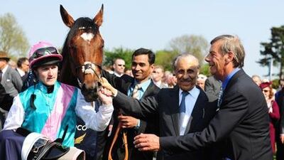 Tom Queally, the jockey, and Frankel are joined by the owner, Prince Khalid Abdullah, of Saudi Arabia, second right, and the trainer Sir Henry Cecil, after winning the Qipco 2000 Guineas Stakes at Newmarket Racecourse.