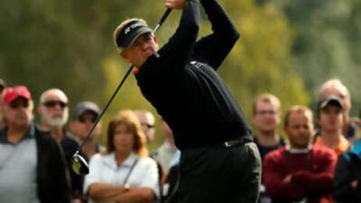 Colin Montgomerie of Scotland plays into the 6th green during the first round of The Quinn Insurance British Masters.
