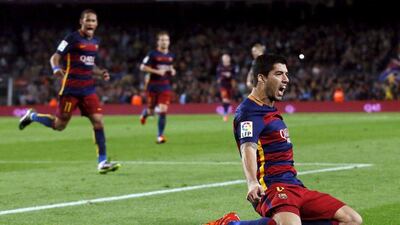 Barcelona’s Luis Suarez celebrates completing his hat-trick against Eibar on Sunday at the Camp Nou in a 3-1 victory. Albert Gea / Reuters