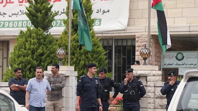 Jordanian police stand outside the offices of the Islamic Action Front in Amman on Thursday. The Muslim Brotherhood-aligned party forms the biggest grouping in the country's parliament. Reuters