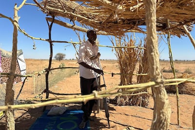 A displaced Sudanese man at a makeshift shelter in the town of Tawila in Darfur. AFP