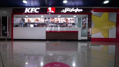 Dining tables are spaced at least two meters apart at Abu Dhabi's Al Wahda Mall food court. Victor Besa / The National