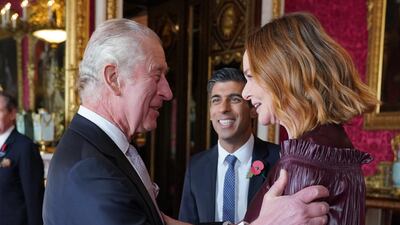 King Charles greets Stella McCartney. PA