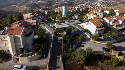 The house of a Palestinian family between Israeli army barriers at the centre of the Jewish settlement of Givon Hahadasha, which borders the West Bank Palestinian village of Beit Ijza. AFP