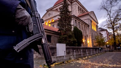 A German police officer stands guard in front of the synagogue in Frankfurt, Germany, in November 2023. AP Photo