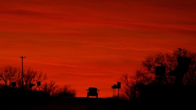 A motorist drives into the sunset in Edgerton, the US state of Kansas. AP