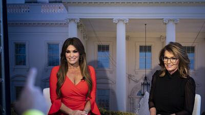 Kimberly Guilfoyle, former Fox News host, left, and Sarah Palin, former governor of Alaska, during a broadcast at the Make America Great Again booth. Bloomberg