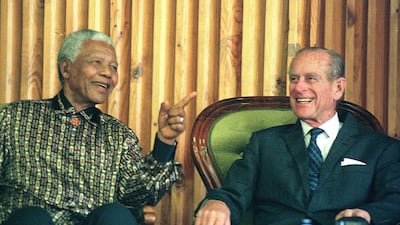 Former South African president Nelson Mandela shares a light moment with the Duke of Edinburgh, Prince Phillip at Drakenstein Prison, Paarl, about 50 kilometres from Cape Town, on November 5, 2000. AFP