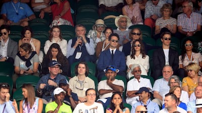 Tony McGill, Caitriona Balfe, Eleanor Tomlinson, Malcolm Tomlinson and Ruth Wilson, in Ralph Lauren, (row behind centre left to right) on day seven of the Wimbledon Championships at the All England Lawn Tennis and Croquet Club. PA