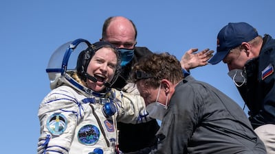 Kate Rubins is helped out of the Soyuz MS-17 spacecraft minutes after the Nasa astronaut, along with Russian cosmonauts Sergey Kud-Sverchkov and Sergey Ryzhikov, arrived in the town of Zhezkazgan, Kazakhstan. AFP