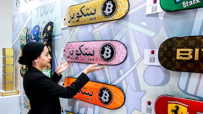 Works from Bitcoin Museum Nashville are displayed at the Bitcoin Mena 2025 conference in Abu Dhabi. Victor Besa / The National