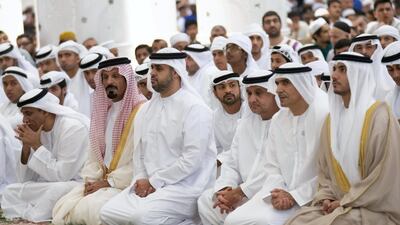 Sheikh Theyab bin Mohammed, Chairman of the Department of Transport, and Abu Dhabi Executive Council Member, fourth left, and other dignitaries, attend Eid Al Fitr prayers. Eissa Al Hammadi for Crown Prince Court - Abu Dhabi