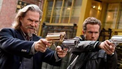 Jeff Bridges, left, and Ryan Reynolds in a scene from R.I.P.D. Courtesy Universal Pictures / AP Photo