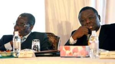 Robert Mugabe, left, and Morgan Tsvangirai at the national dedication ceremony to promote peace in Harare last week.