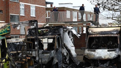The burnt-out remains of the ambulances after the arson attack. AFP