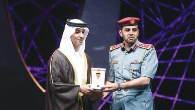 Sheikh Hazza honours Suhail Al Khaili. Colonel Al Khaili is head of vehicle licencing section at the vehicles and drivers licensing department in Abu Dhabi Police and is responsible for 17 new initiatives.
