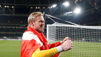 Denmark goalkeeper Kasper Schmeichel celebrates in front of their fans after the match. Reuters