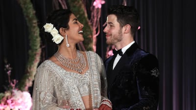 Newlyweds Priyanka Chopra, 36, and Nick Jonas, 26, pose for a photograph during a reception at a hotel in New Delhi on December 4, 2018. Photo: EPA