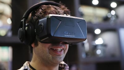 A man tries out the Oculus Rift VR headset. Jae Hong / AP Photo