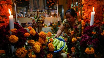 Offerings are placed at an altar in homage to a family member who died recently during the annual Day of the Dead celebration. Reuters