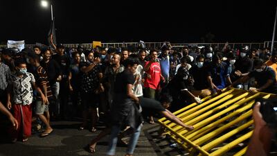 The curfew has been lifted but the president and his elder brother Prime Minister Mahinda Rajapaksa continue to hold on to power.