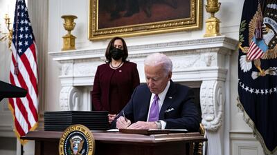 President Joe Biden signs an executive order after speaking during an event on his administration's Covid-19 response. Bloomberg