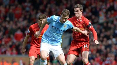 Manchester City's Edin Dzeko, centre, in action with Liverpool's Jordan Henderson, right, will be one of the main targets for Inter Milan during the summer transfer window the club said Thursday. EPA/PETER POWELL