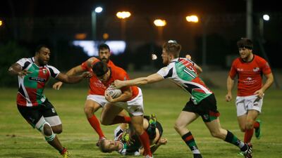 Abu Dhabi Saracens, in red, in action against the Abu Dhabi Harlequins at Al Ghazal Golf Club Rugby field in October 2016. Ravindranath K / The National