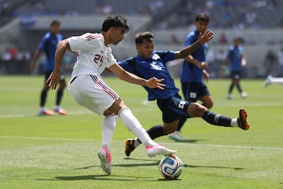 Qatar's Tahsin Jamshid, left, during a friendly against El Salvador in Los Angeles. AFP