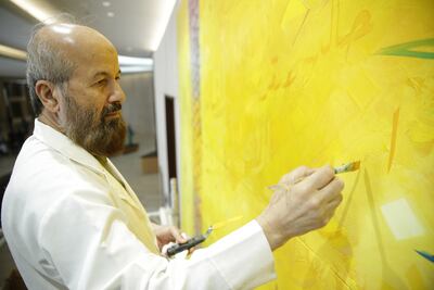 Emirati artist Abdul Qader Al Rais in his studio. Photo: The Dubai Culture and Arts Authority