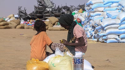 Sudanese girls who fled El Fasher in Darfur receive humanitarian aid at the Al Afad camp for displaced people in the town of Al Dabba in northern Sudan. AFP