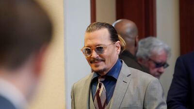Depp arrives for day three of his ex-wife's evidence. AP