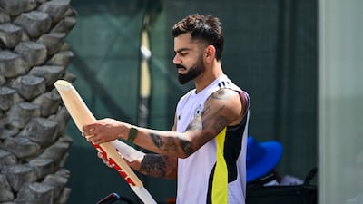 India's Virat Kohli checks his bat during a practice session at the ICC Academy in Dubai ahead of the clash against Pakistan in the Champions Trophy on Sunday. AFP